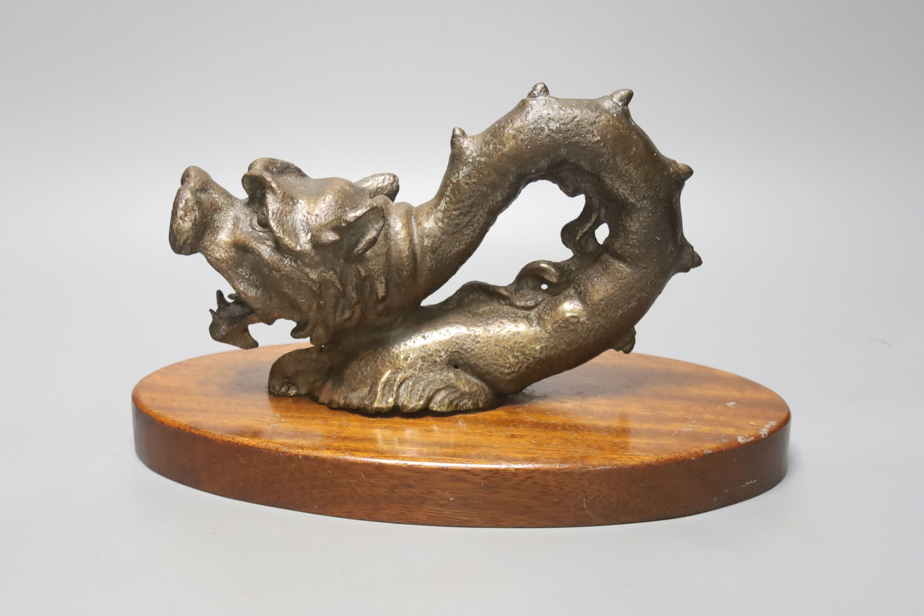 An Indonesian bronze dragon, on stand, height 17cm